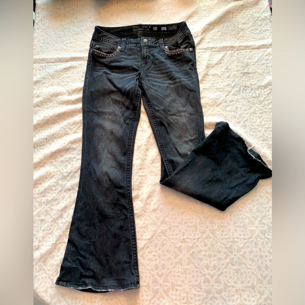 Miss Me black wash  with metallic stitching on front and back pockets